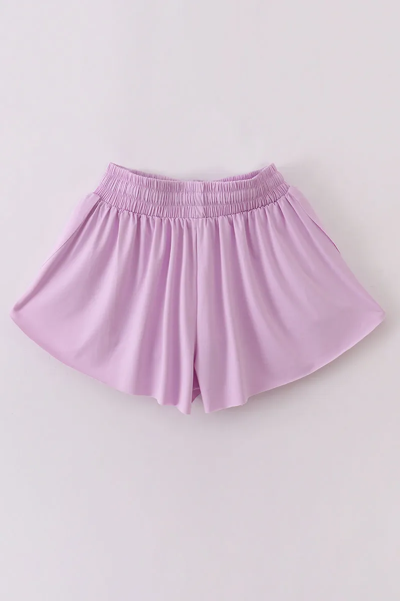 Purple woman sports shorts